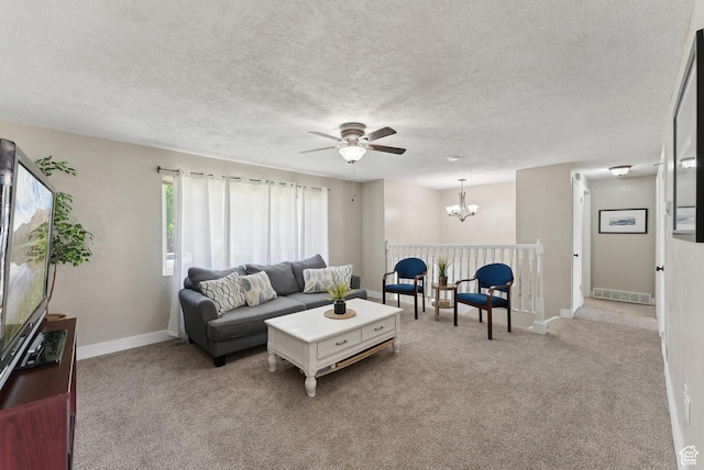 222 N 600th St E, Orem, UT 84097 - living room featuring visible vents, baseboards, light colored carpet, a textured ceiling, and ceiling fan with notable chandelier