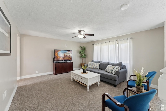 222 N 600th St E, Orem, UT 84097 - living area featuring baseboards, a textured ceiling, light colored carpet, and ceiling fan