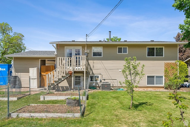 222 N 600th St E, Orem, UT 84097 - rear view of house featuring french doors, a garden, a lawn, central AC unit, and fence