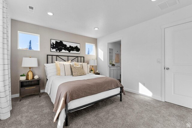 carpeted bedroom featuring visible vents, recessed lighting, and multiple windows