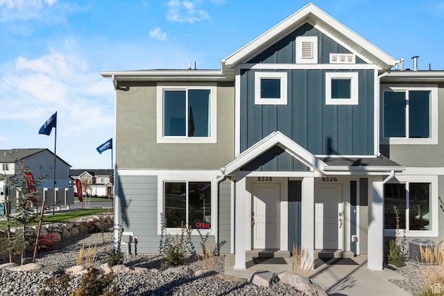 view of front of property featuring central AC unit and board and batten siding