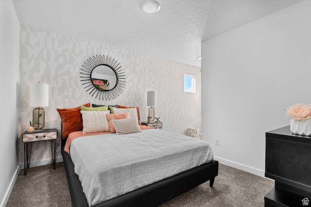 carpeted bedroom featuring baseboards and wallpapered walls