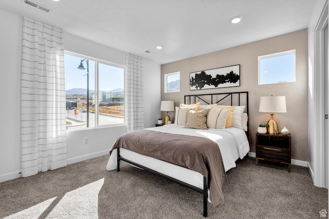 bedroom with baseboards, carpet, recessed lighting, and visible vents
