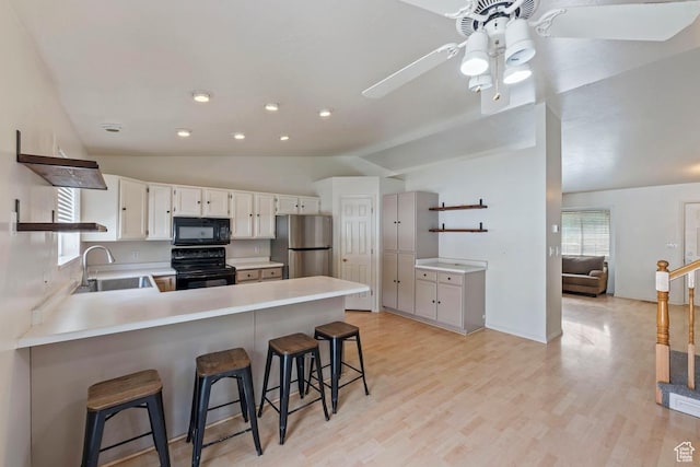 10046 N Sage Rd W, Cedar Hills, UT 84062 - kitchen featuring open shelves, lofted ceiling, a sink, and black appliances