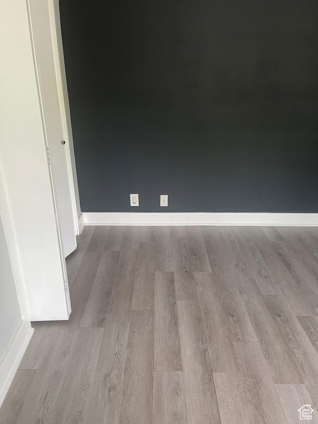 1206 E Waterside Cv Unit 21, Cottonwood Heights, UT 84047 - spare room with baseboards and wood finished floors
