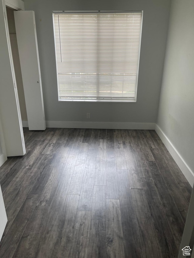 1206 E Waterside Cv Unit 21, Cottonwood Heights, UT 84047 - unfurnished room with dark wood-type flooring and baseboards