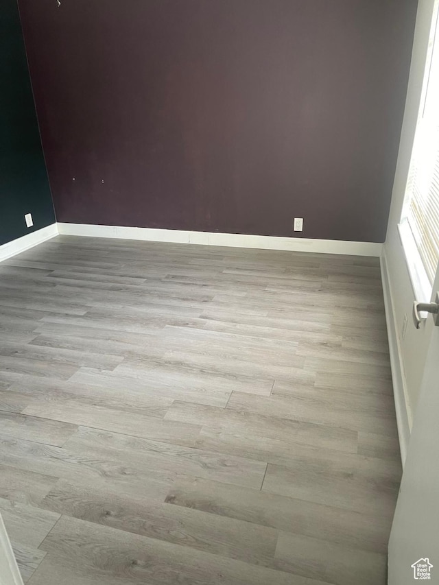 1206 E Waterside Cv Unit 21, Cottonwood Heights, UT 84047 - spare room with baseboards and wood finished floors