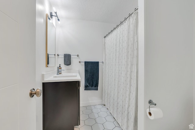 6294 W 7830 S, West Jordan, UT 84081 - full bath featuring vanity, a textured ceiling, a shower with shower curtain, and tile patterned floors