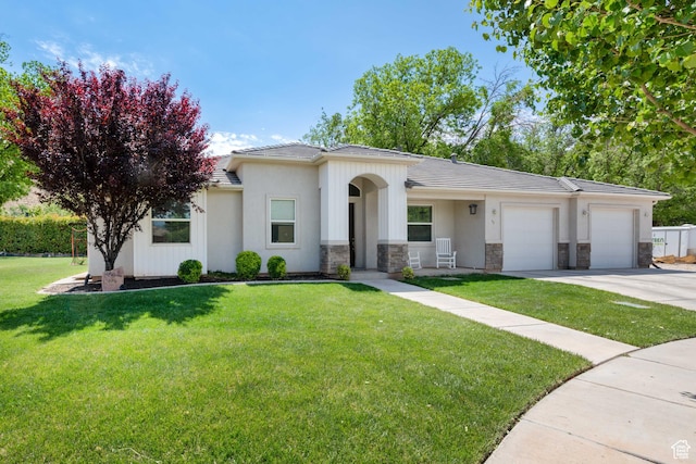 ranch-style home with a tile roof, a garage, a front lawn, concrete driveway, and stone siding