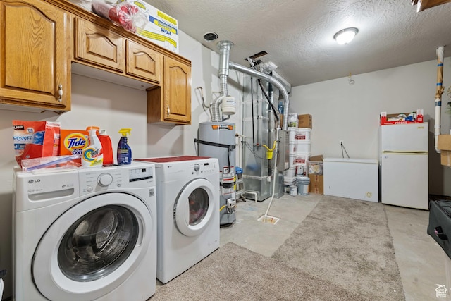 washroom with heating unit, separate washer and dryer, strapped water heater, and cabinet space