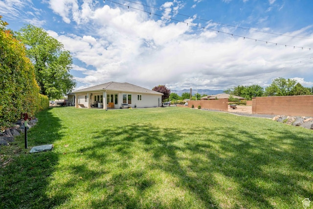view of yard with fence