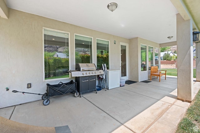 view of patio featuring a grill