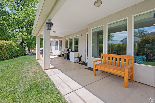 view of patio featuring a grill