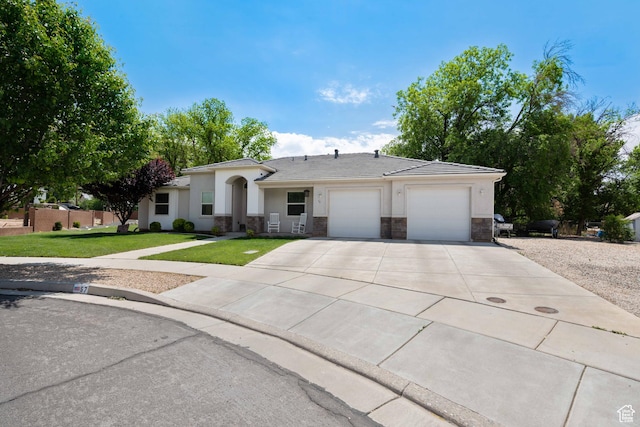 single story home with a front lawn, stone siding, a garage, stucco siding, and concrete driveway