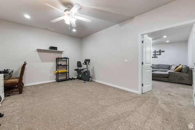 interior space featuring visible vents, carpet flooring, baseboards, and ceiling fan