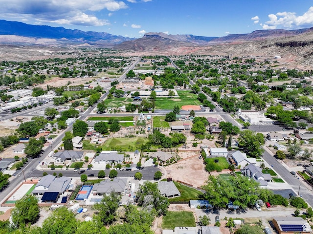 drone / aerial view featuring a residential view and a mountain view
