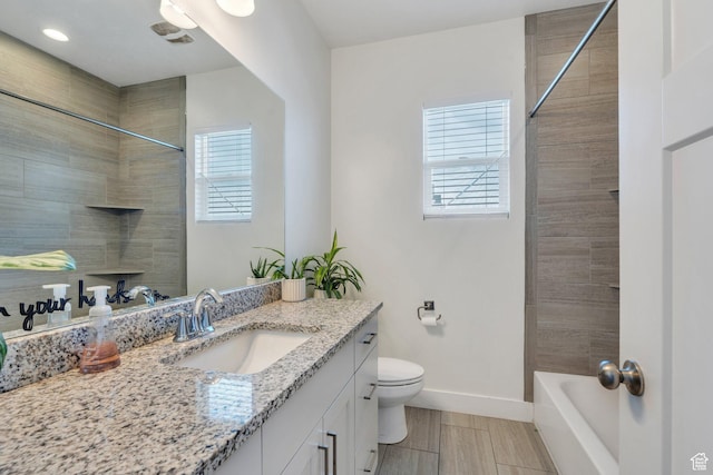 289 W Lauren N, Tooele, UT 84074 - bathroom with baseboards, toilet, and vanity