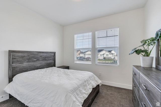 289 W Lauren N, Tooele, UT 84074 - bedroom with baseboards and dark carpet