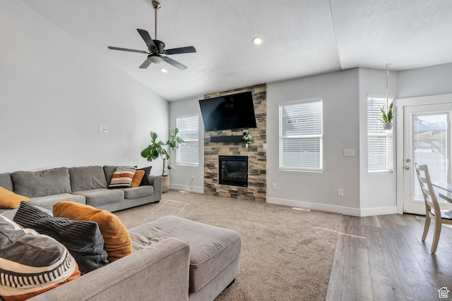 289 W Lauren N, Tooele, UT 84074 - living area featuring baseboards, ceiling fan, a healthy amount of sunlight, and a stone fireplace