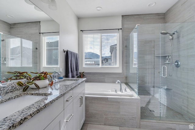 289 W Lauren N, Tooele, UT 84074 - bathroom featuring a sink, a garden tub, and a stall shower
