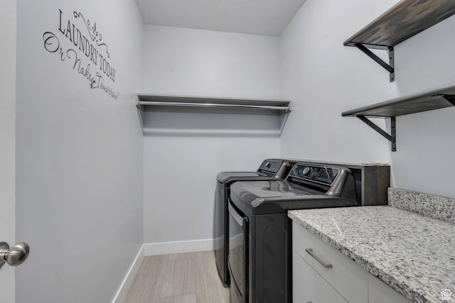 289 W Lauren N, Tooele, UT 84074 - clothes washing area featuring baseboards, light wood-type flooring, and washer and dryer