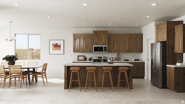 1490 N Daylight St Unit 94, Washington, UT 84780 - kitchen featuring a kitchen breakfast bar, a notable chandelier, appliances with stainless steel finishes, and recessed lighting