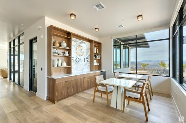 1490 N Daylight St Unit 94, Washington, UT 84780 - dining area with visible vents, light wood-style floors, baseboards, and a healthy amount of sunlight