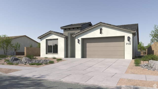 view of front of house with concrete driveway, an attached garage, fence, and stucco siding