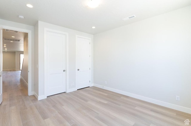 5337 S Beachcomber Ln Unit 141, St George, UT 84790 - unfurnished bedroom featuring light wood-style floors, baseboards, recessed lighting, and a closet
