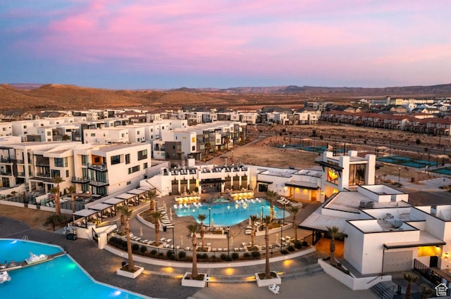 5337 S Beachcomber Ln Unit 141, St George, UT 84790 - drone / aerial view of a pool and a mountain backdrop