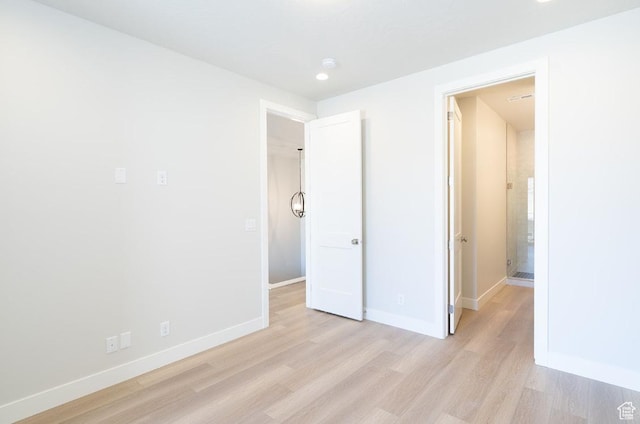 5337 S Beachcomber Ln Unit 141, St George, UT 84790 - unfurnished bedroom featuring light wood finished floors, baseboards, and recessed lighting