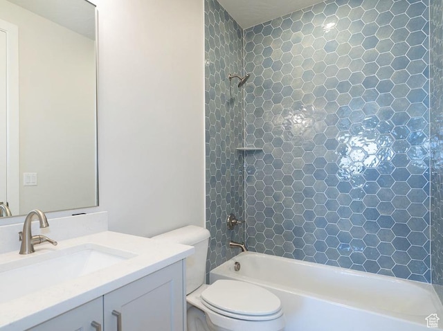 bathroom featuring vanity, washtub / shower combination, and toilet