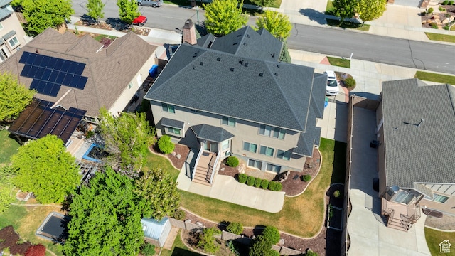 birds eye view of property with a residential view