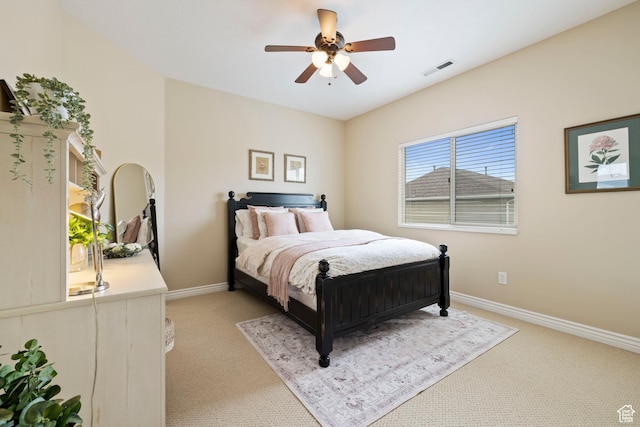 bedroom featuring light carpet, baseboards, a ceiling fan, and visible vents