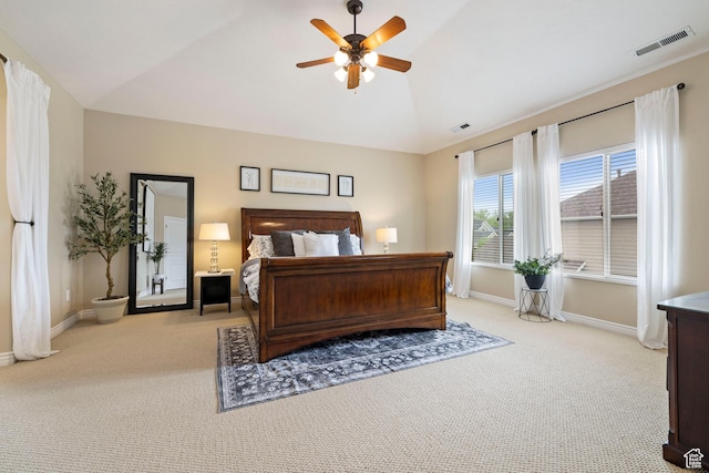 bedroom with lofted ceiling, baseboards, visible vents, and carpet floors