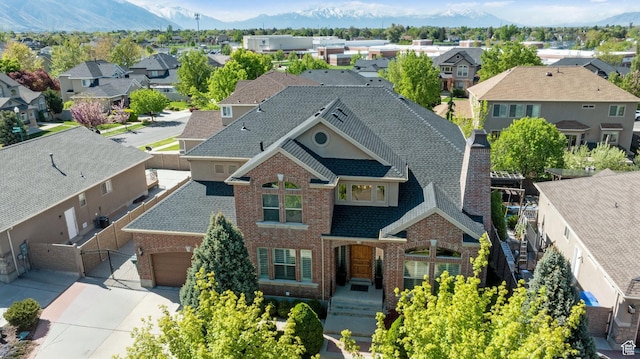 aerial view with a mountain view and a residential view