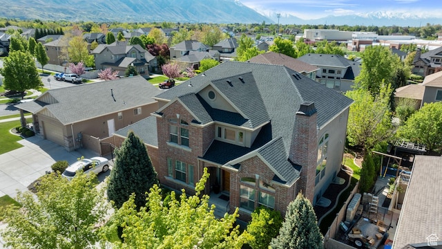 aerial view featuring a mountain view and a residential view