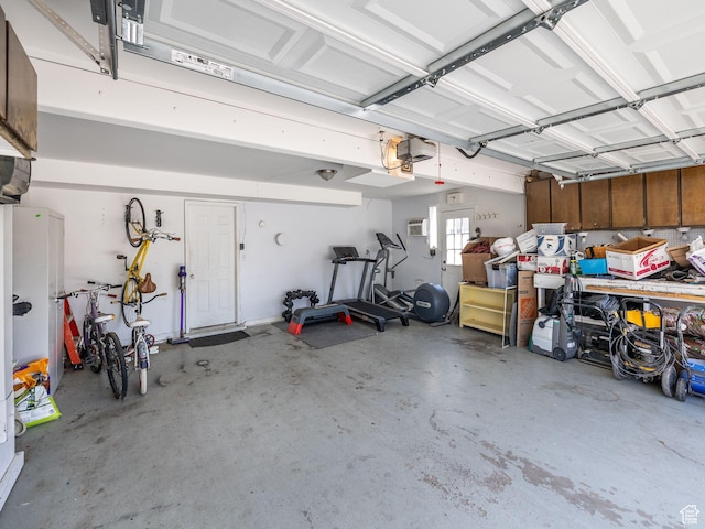 7123 S Watermill Way, Cottonwood Heights, UT 84121 - garage featuring a garage door opener and a wall mounted air conditioner