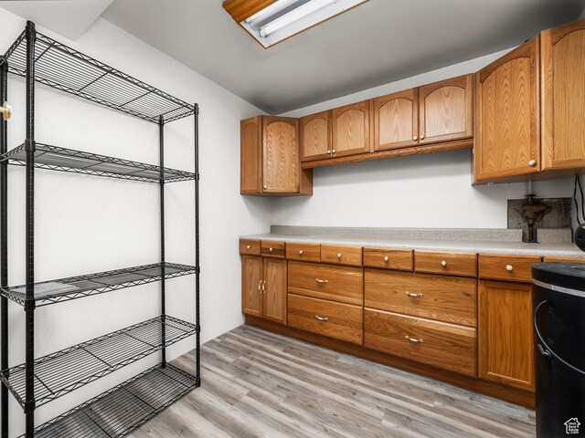7123 S Watermill Way, Cottonwood Heights, UT 84121 - kitchen featuring brown cabinetry, light countertops, and light wood finished floors