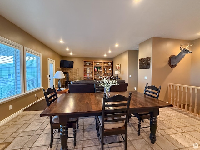 dining room with recessed lighting, baseboards, and light tile patterned floors