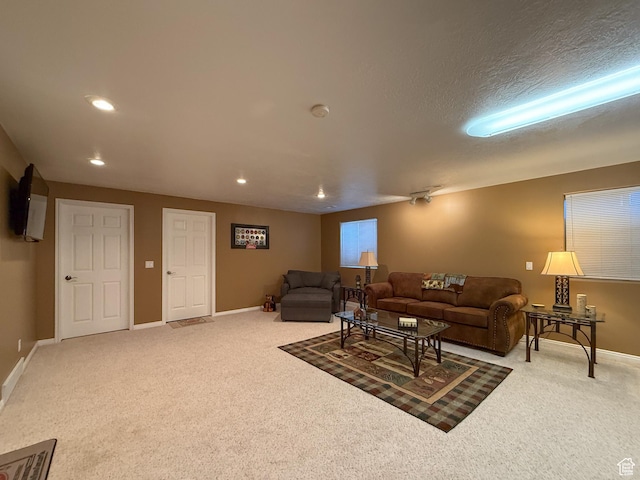 living room featuring baseboards, recessed lighting, and carpet