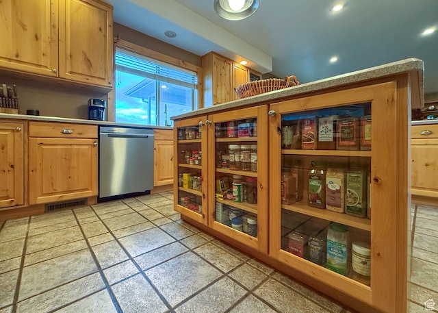 kitchen featuring light brown cabinets, light countertops, recessed lighting, stainless steel dishwasher, and visible vents