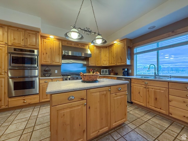 kitchen with a sink, light brown cabinets, stainless steel dishwasher, and wall chimney exhaust hood