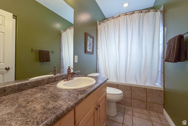 bathroom featuring vanity, recessed lighting, tiled shower / bath, and toilet