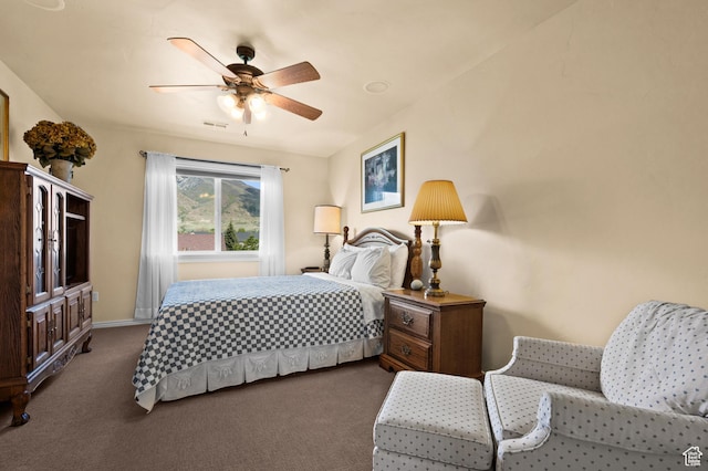 carpeted bedroom with baseboards, ceiling fan, and visible vents