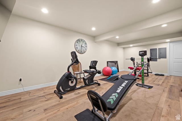 exercise room with recessed lighting, baseboards, and wood finished floors