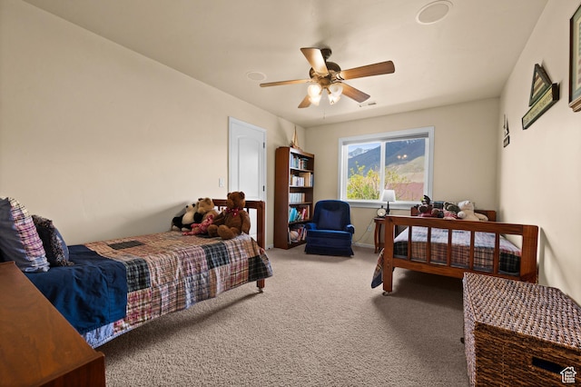 carpeted bedroom featuring a ceiling fan