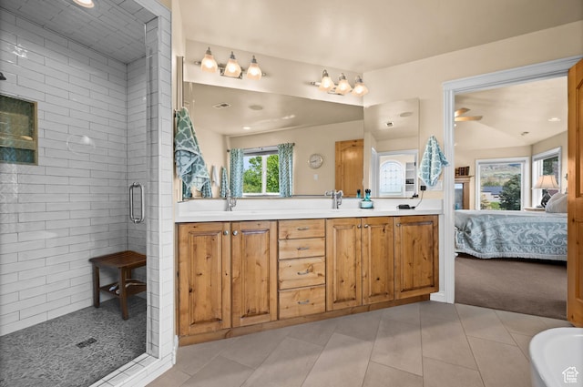 bathroom with double vanity, ensuite bath, tile patterned flooring, a stall shower, and recessed lighting