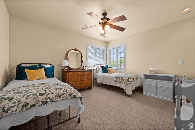 carpeted bedroom with ceiling fan