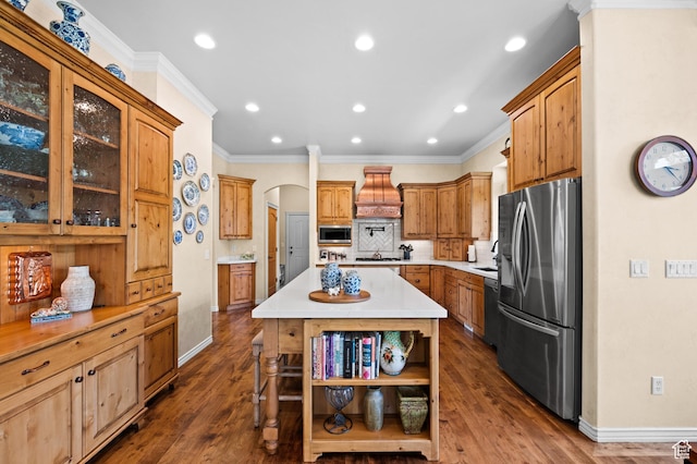 kitchen featuring open shelves, custom exhaust hood, baseboards, arched walkways, and stainless steel appliances